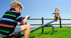 kids playing on a teeter-totter