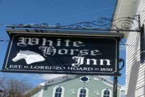 white horse sign above restaurant in metamora