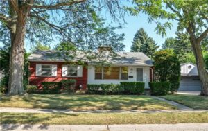 great red and white starter home in lapeer