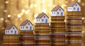 houses lined up on top of coins