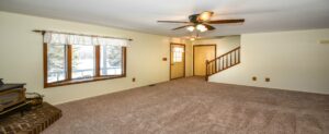 updated living room in a home for sale in capac.